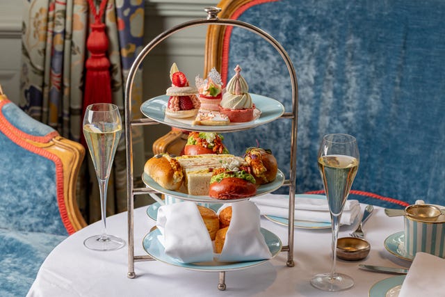 Afternoon tea set with pastries and drinks. Afternoon tea set with pastries and drinks.