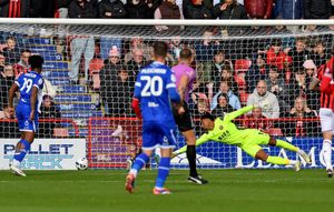 Myles Roberts is unable to prevent Bristol Rovers from taking the lead