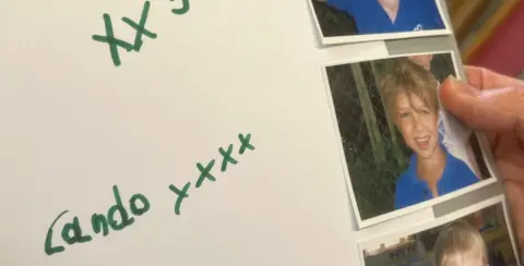 A photo of a young Lando Norris with his name written alongside it in green ink