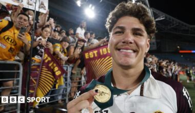 Reece Walsh holds up his medal