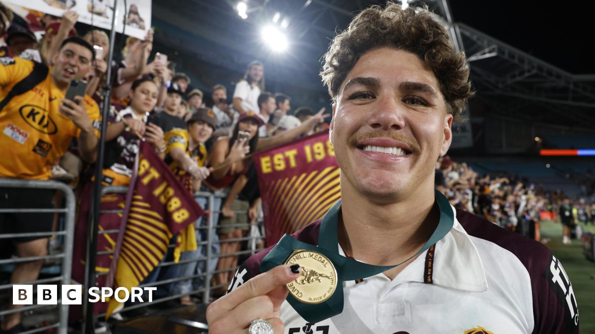 Reece Walsh holds up his medal