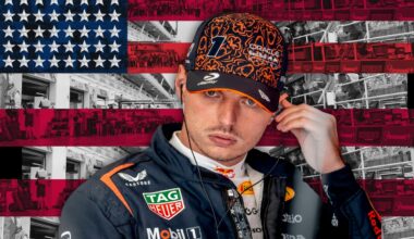 Verstappen looking concentrated as he puts an earphone in with a US-flag themed background