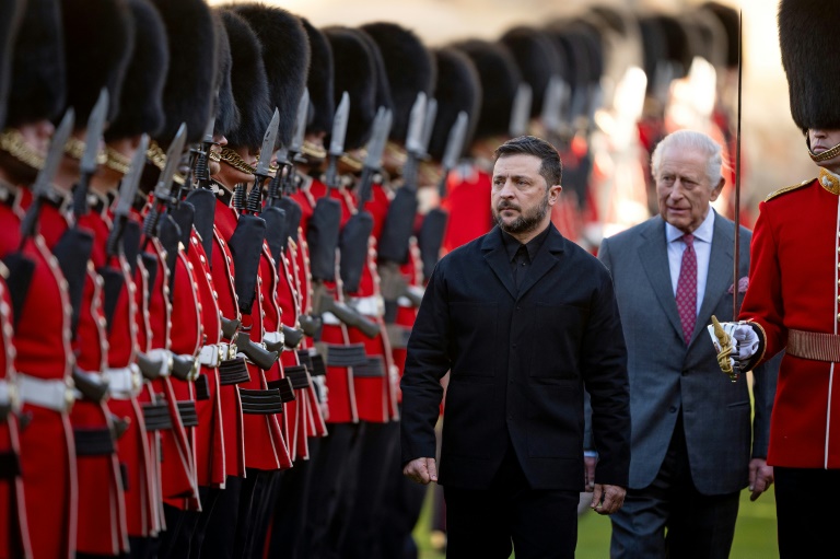 Ukraine President Volodymyr Zelensky walks with King Charles III and Maj Ben Tracey as they inspect a Guard of Honour formed by the 1st Battalion Grenadier Guards, at Windsor Castle, on Oct 24, 2025, ahead of a Coalition of the Willing meeting in London. (Photo: AFP)