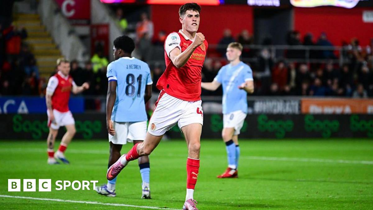Josh Ayres celebrates with a clenched fist after scoring Rotherham's second goal against Manchester City