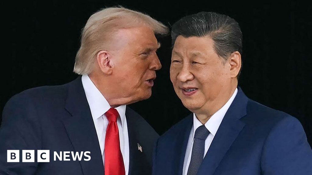 Donald Trump leaning in to speak into Xi Jinping's ear