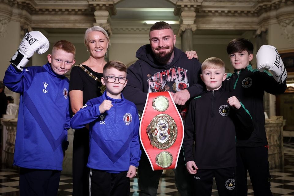 Young boxers Ethan Hoy and Charlie Kidd (Taughmonagh Young Men's Academy) and Sean McGarry and Cayden Collins (Holy Trinity Boxing Club) join Lord Mayor of Belfast, Councillor Tracy Kelly,  and IBF World Welterweight Champion Lewis Crocker, at a special civic reception in City Hall