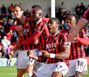 Aaron Pressley celebrates with his Walsall teammates