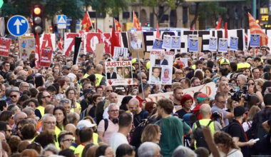 Tens of thousands protest a year after deadly floods
