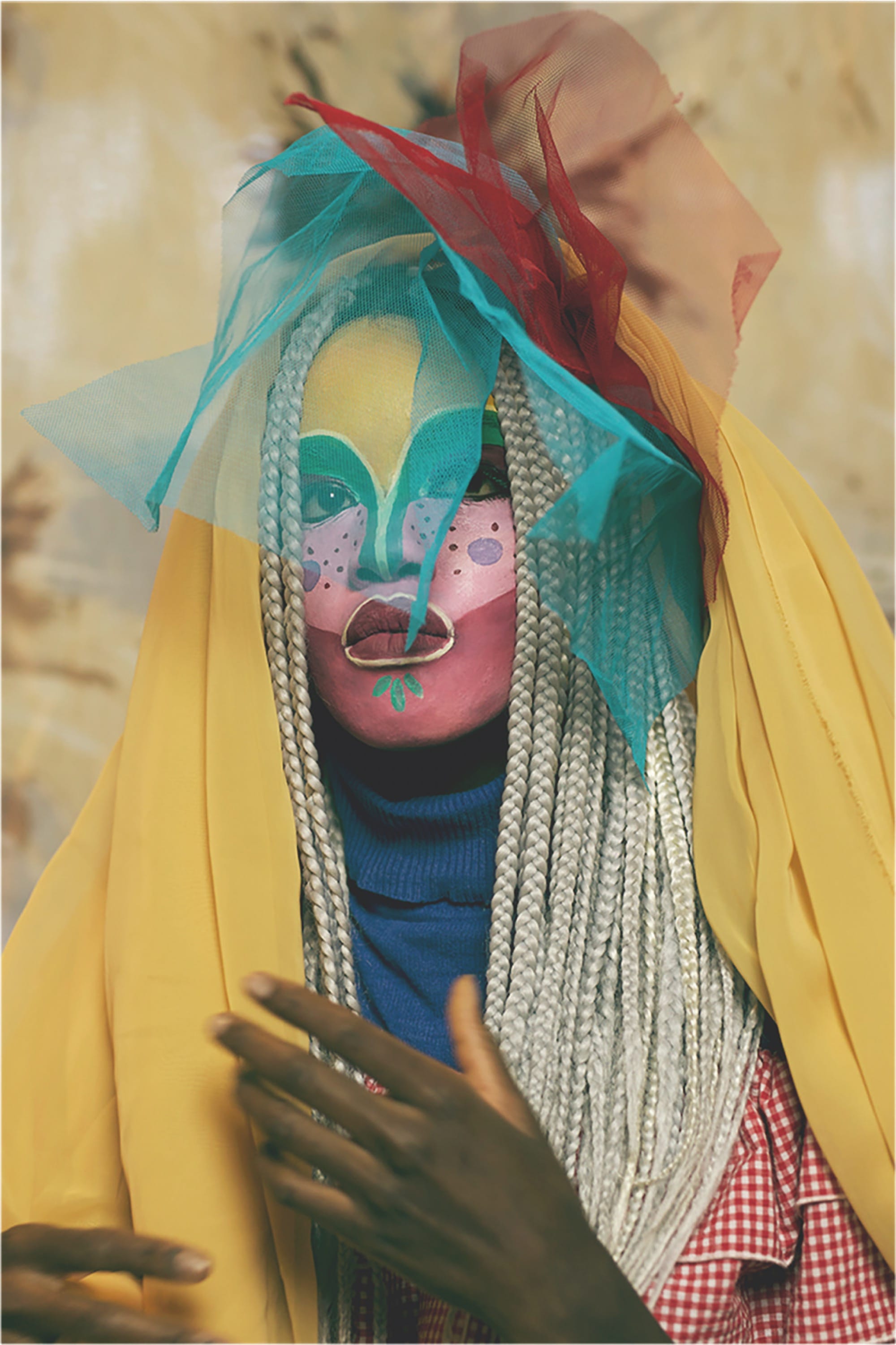 a photo by Atong Atem of a woman dressed in vibrant clothes with blonde braids and face paint
