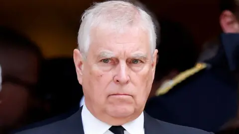 Getty Images Prince Andrew in a dark suit and tie with a white shirt