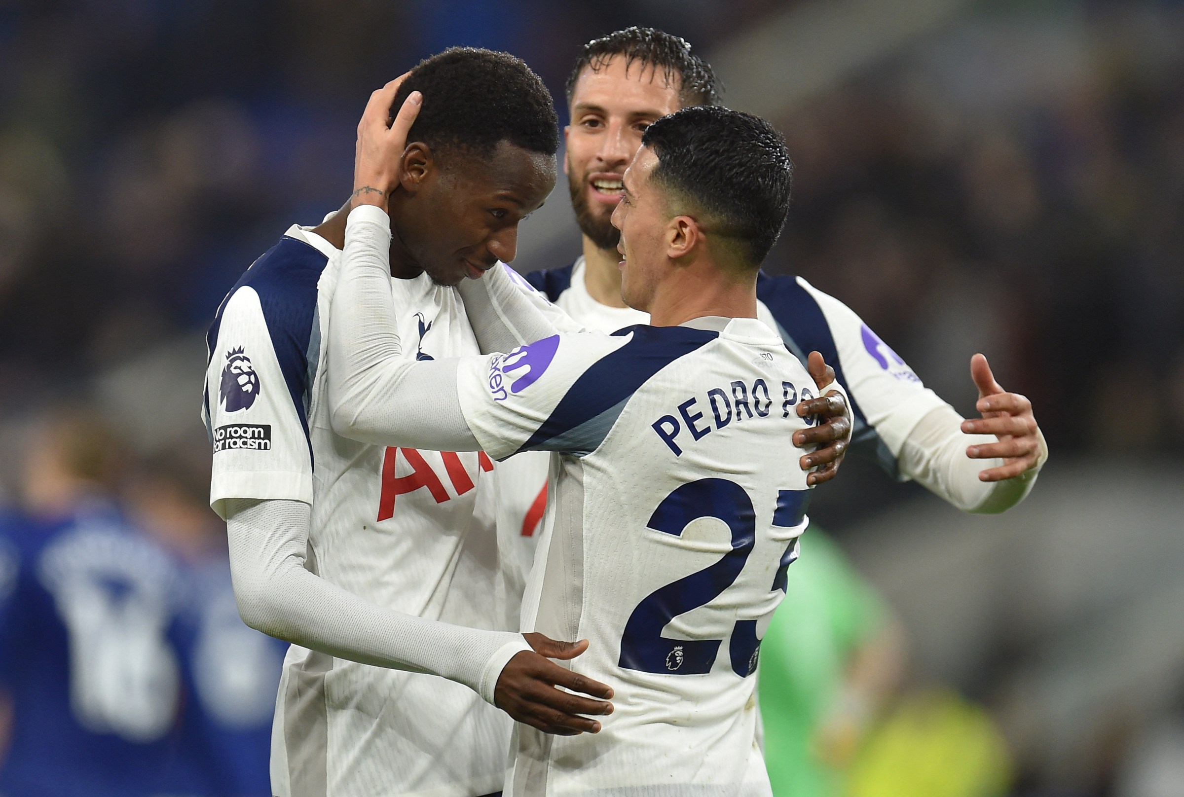 Pape Matar Sarr (L) celebrates with Rodrigo Bentancur. (Photo by PETER POWELL/AFP via Getty Images)