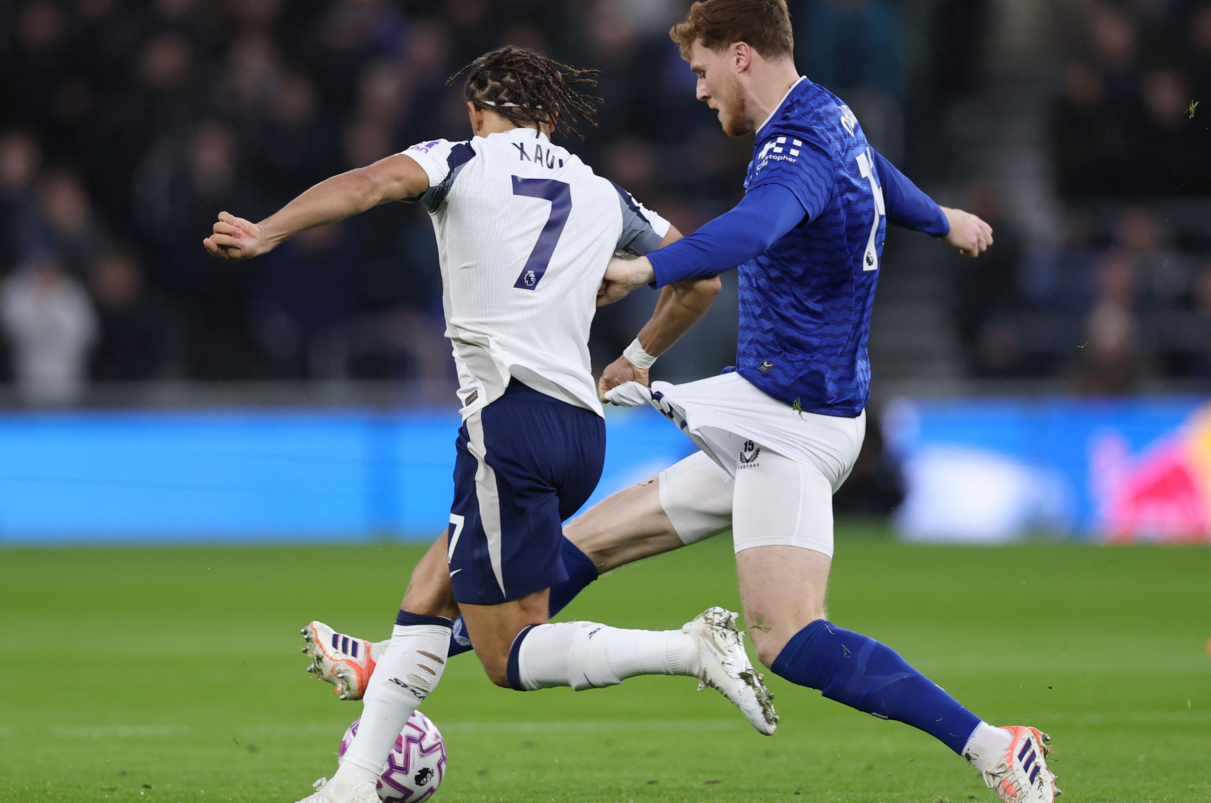 Jake O’Brien of Everton is challenged by Xavi Simons. (Photo by Stu Forster/Getty Images)