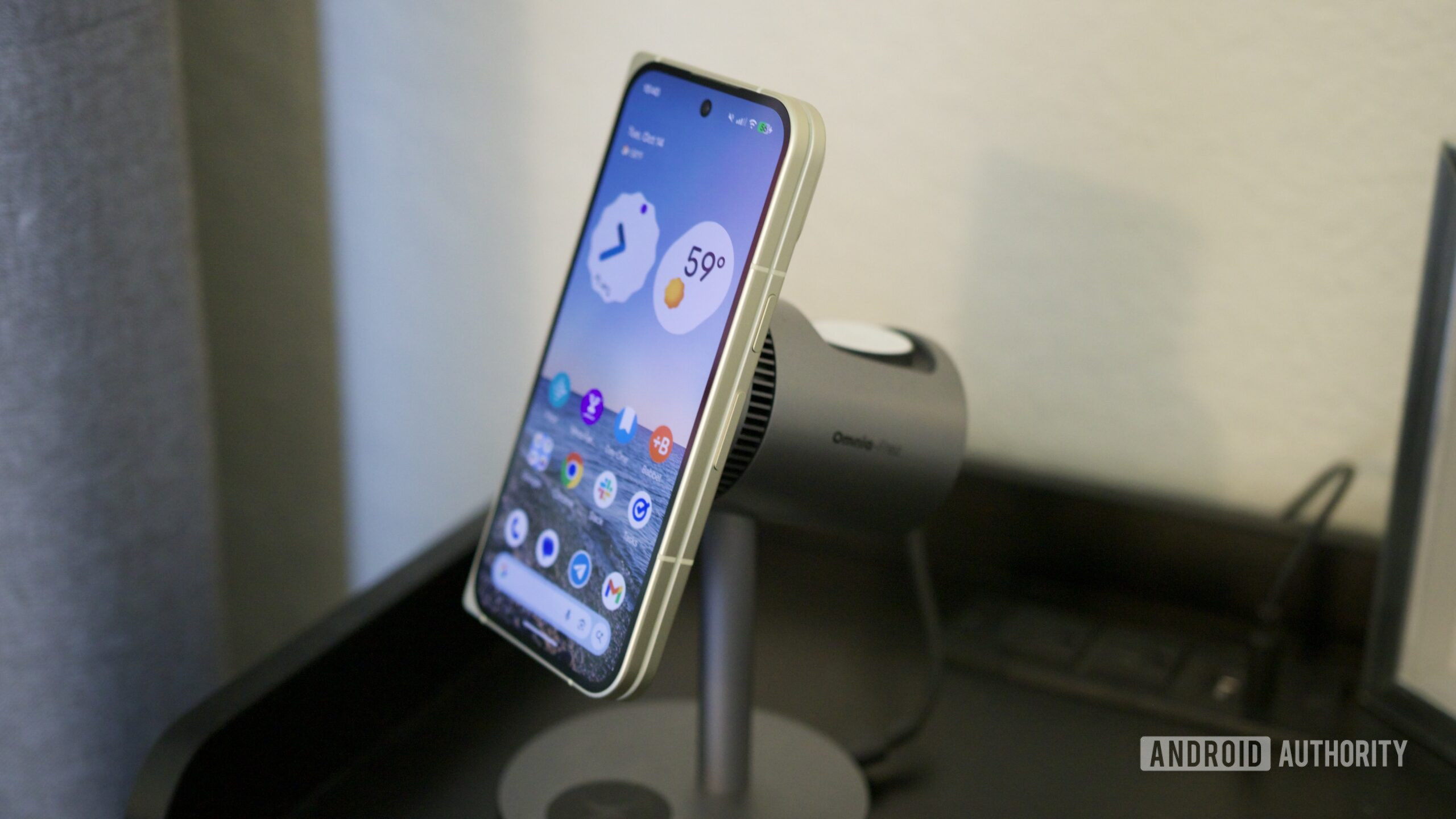The Google Pixel 10 Pro Fold attached to a magnetic charging stand.