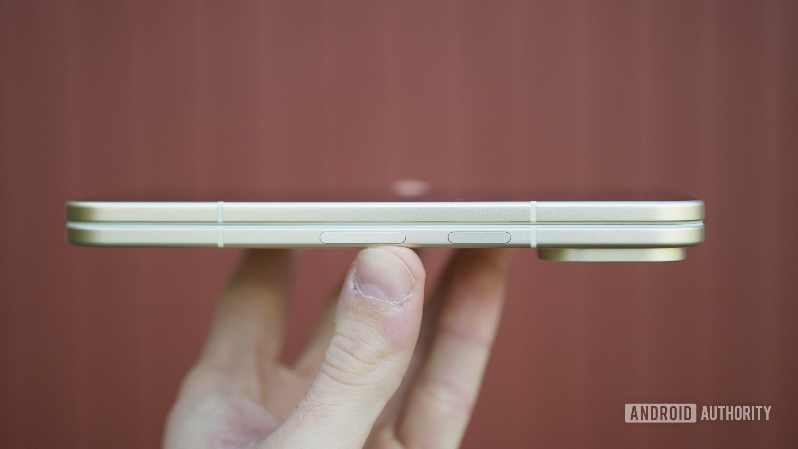 Someone holding the Google Pixel 10 Pro Fold, showing the thickness of the phone when folded.