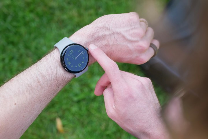 Someone using the crown on the Google Pixel Watch 3.