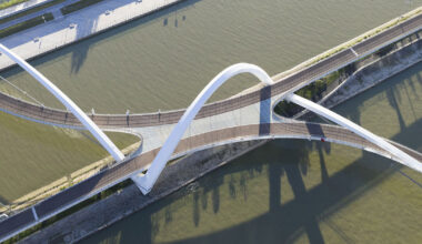 zaha hadid architects draws from silk embroidery with serpentine footbridge
