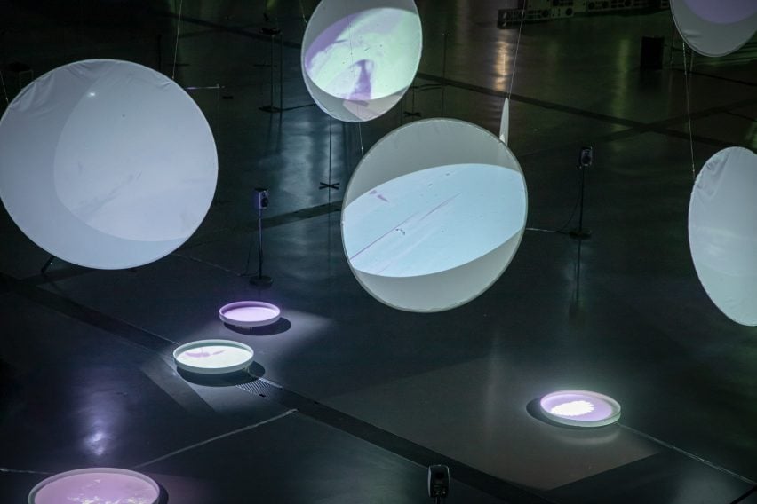 a photograph of an installation featuring circular models