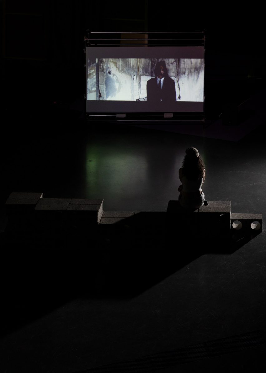 a photograph of a person viewing a screen