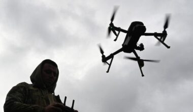 A Ukrainian serviceman operates a drone during a competition that simulates combat conditions