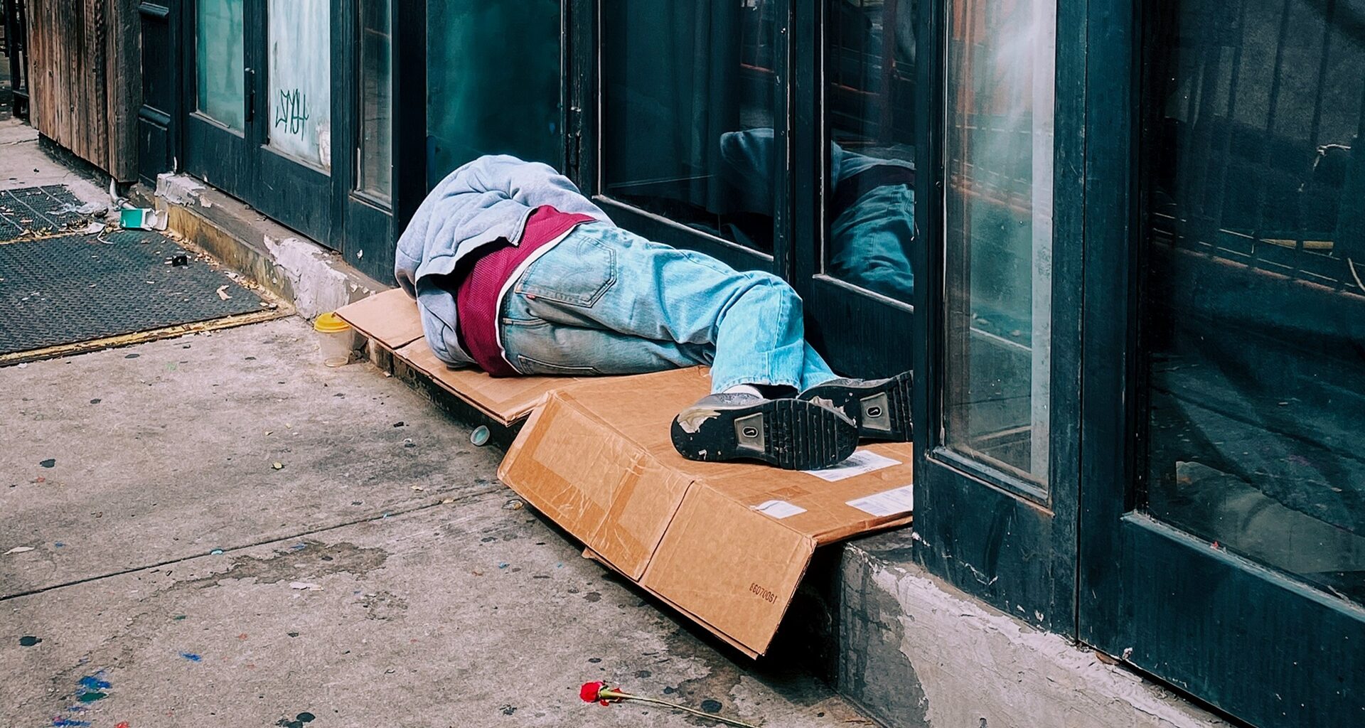 a man sleeping rough on the street
