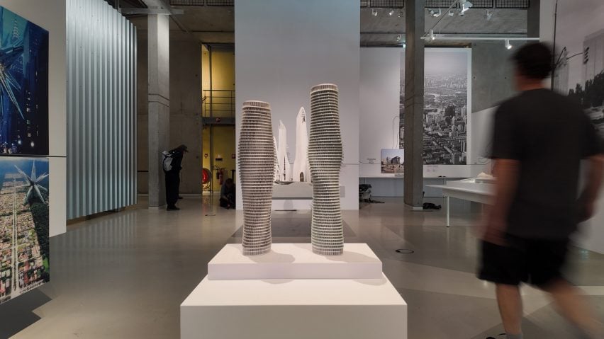Interior exhibition shot with two tall tower model