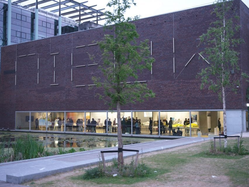 Exterior view of the Nieuwe Instituut with pond and trees