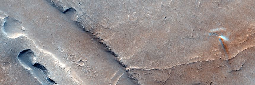 The blurred motion of a dust devil can be seen dancing on Mars on December 3, 2021, through the Colour and Stereo Surface Imaging System on ExoMars Trace Gas Orbiter.