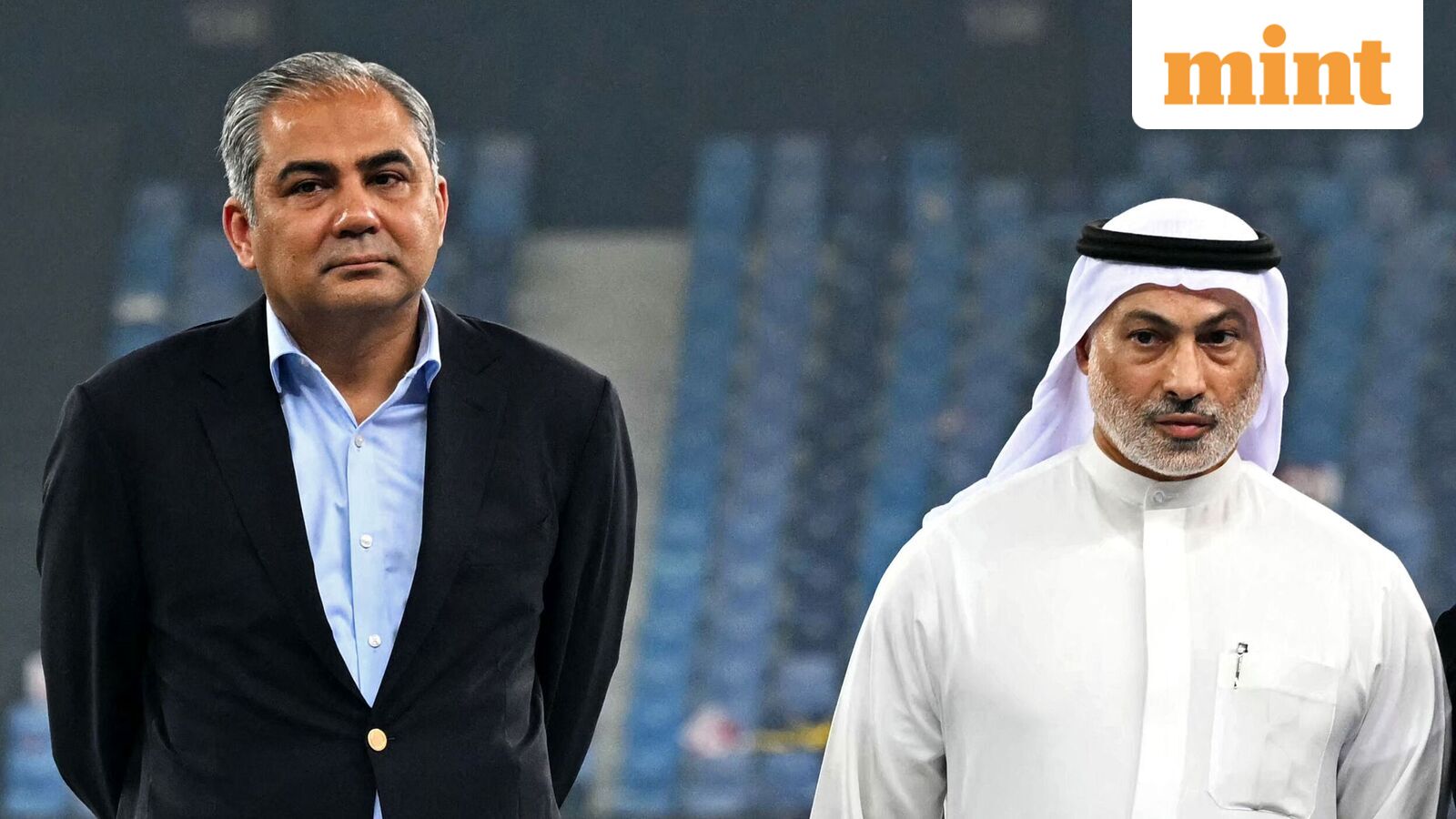 Asian Cricket Council (ACC) and Pakistan Cricket Board (PCB) chairman Mohsin Naqvi (L) stands along with Emirates Cricket Board Vice Chairman Khalid Al Zarooni at the end of the Asia Cup 2025 Twenty20 international cricket final match between India and Pakistan at the Dubai International Stadium in Dubai on September 28, 2025. (Photo by Sajjad HUSSAIN / AFP)