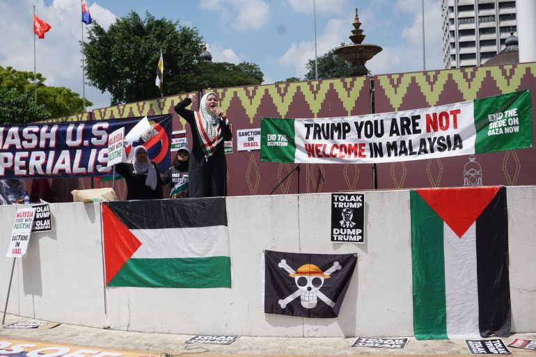 Protesters rally against US President Donald Trump's visit to Malaysia at Kuala Lumpur's Independence Square on October 26, 2025. [Erin Hale/ Al Jazeera]