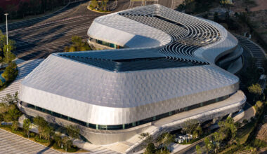 scale-like facade wraps hushan swimming center by LYCS architecture