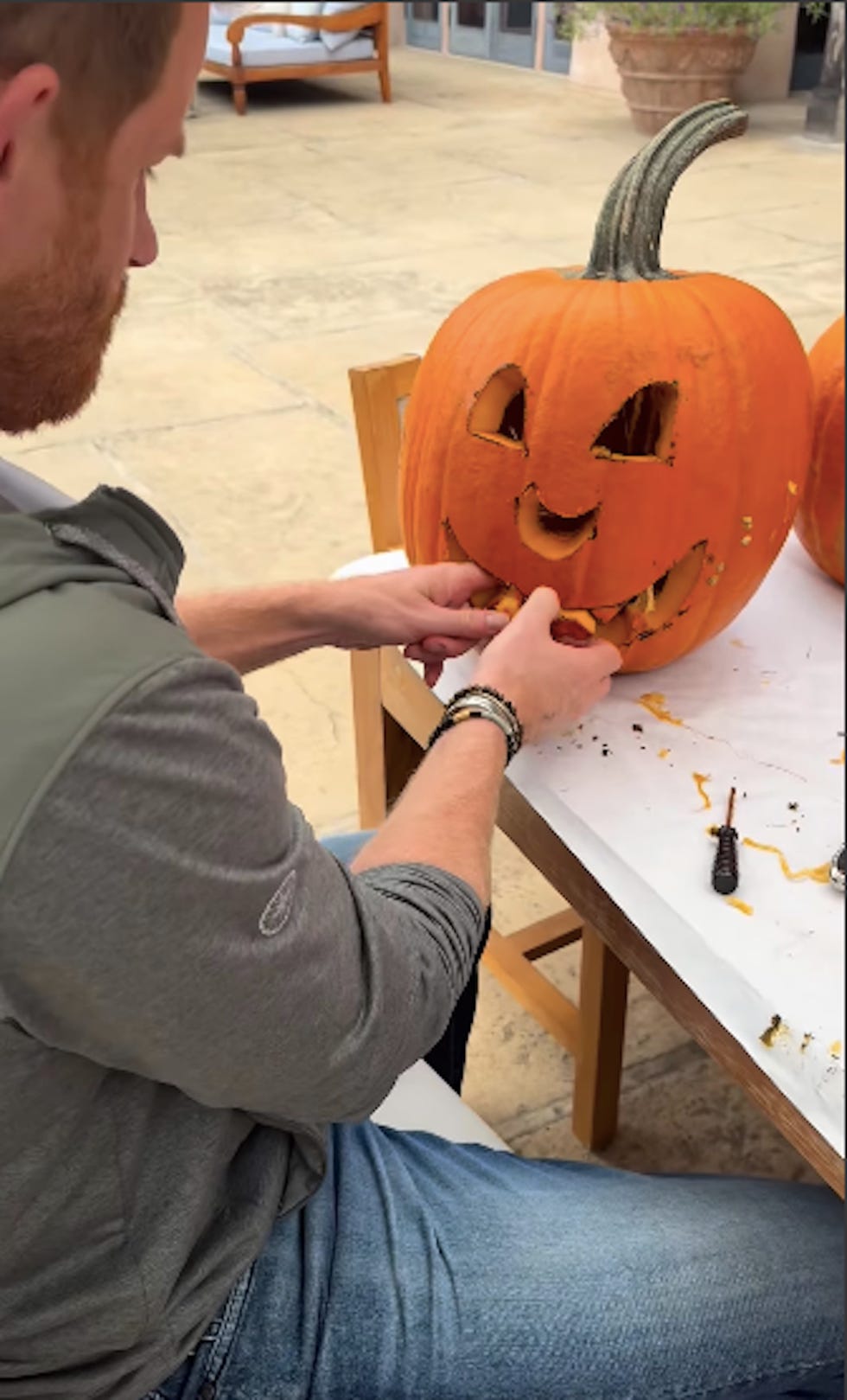 carving a pumpkin into a jackolantern