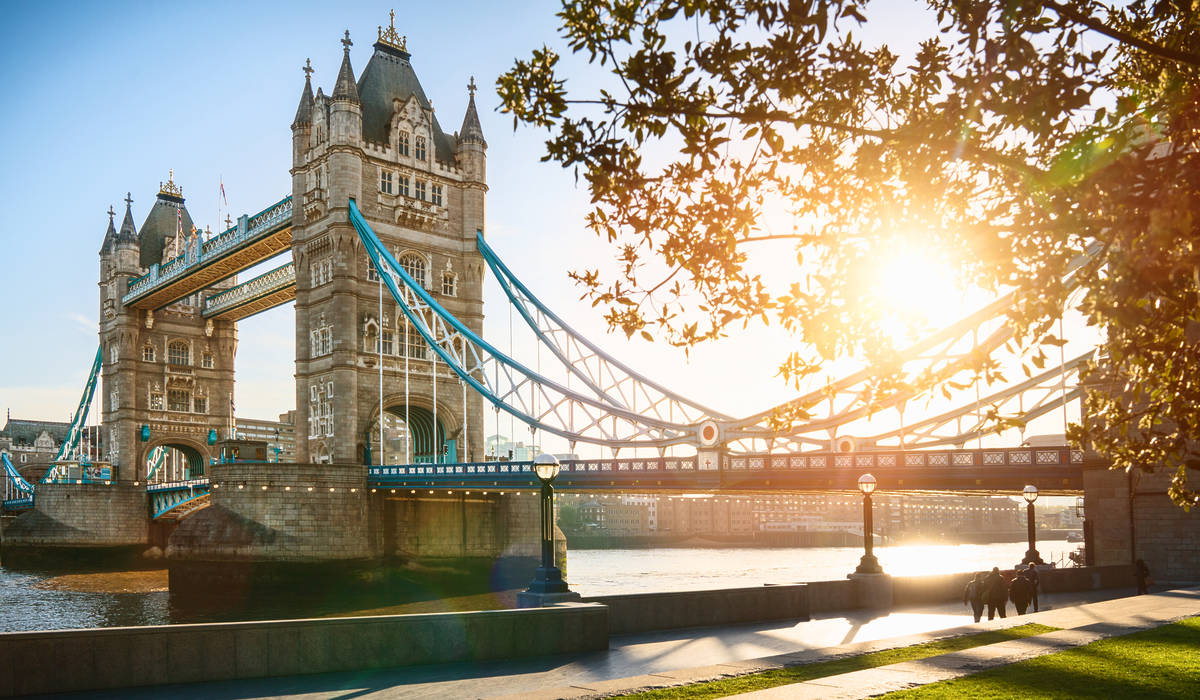 The London Tower bridge at sunrise on a sunny summer day - shot against blue clear sky into the shining sun