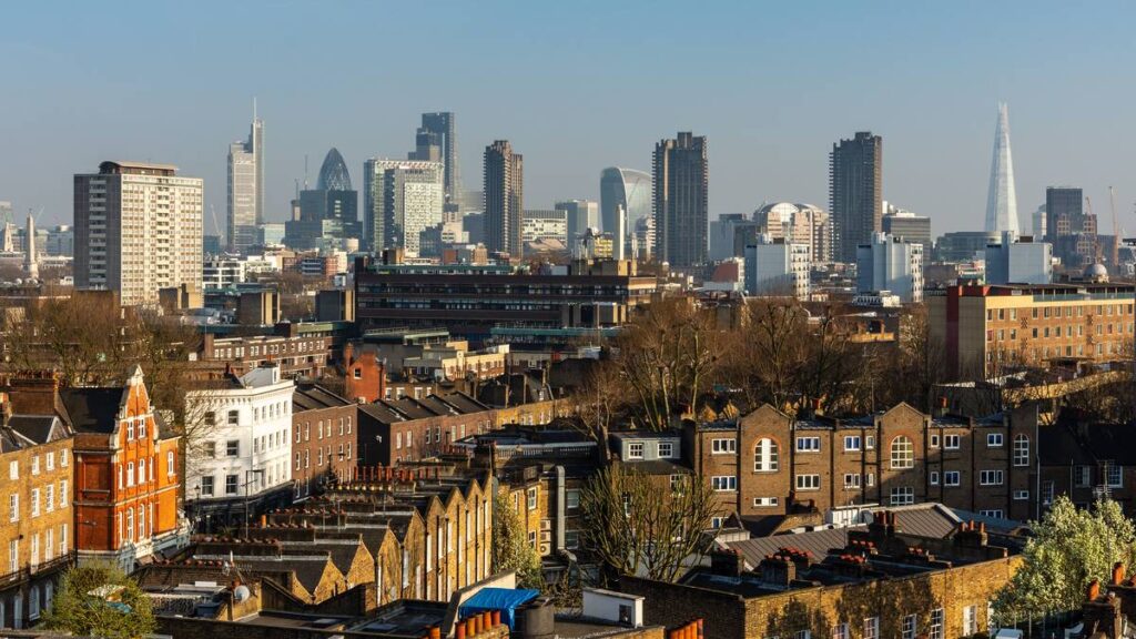 A view of London's skyline from above the rooftops of buildings in London