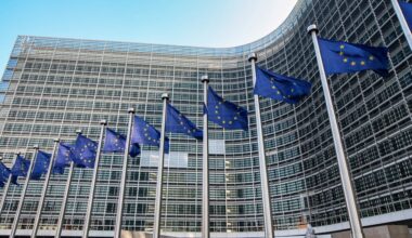 European flags on the background of the European Parliament.