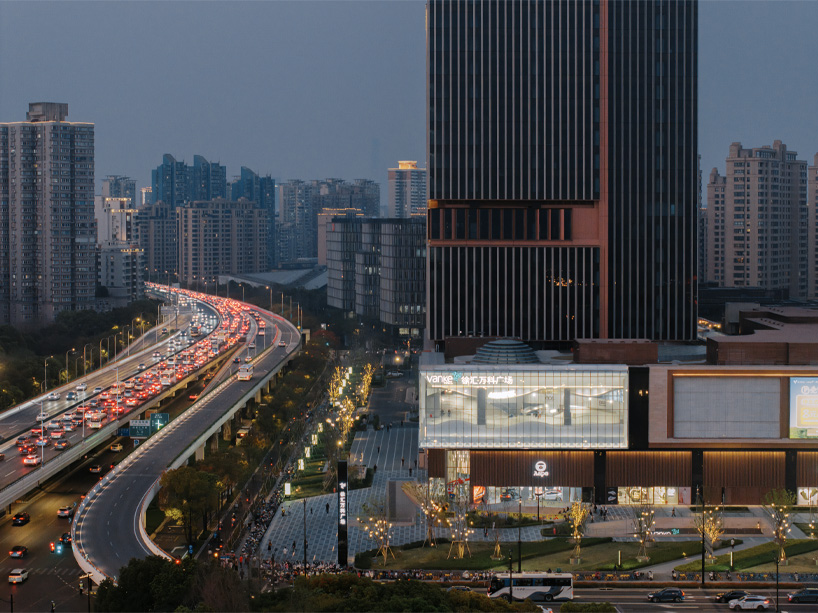 curved urban skatepark set within floating glass volume overlooks shanghai’s skyline