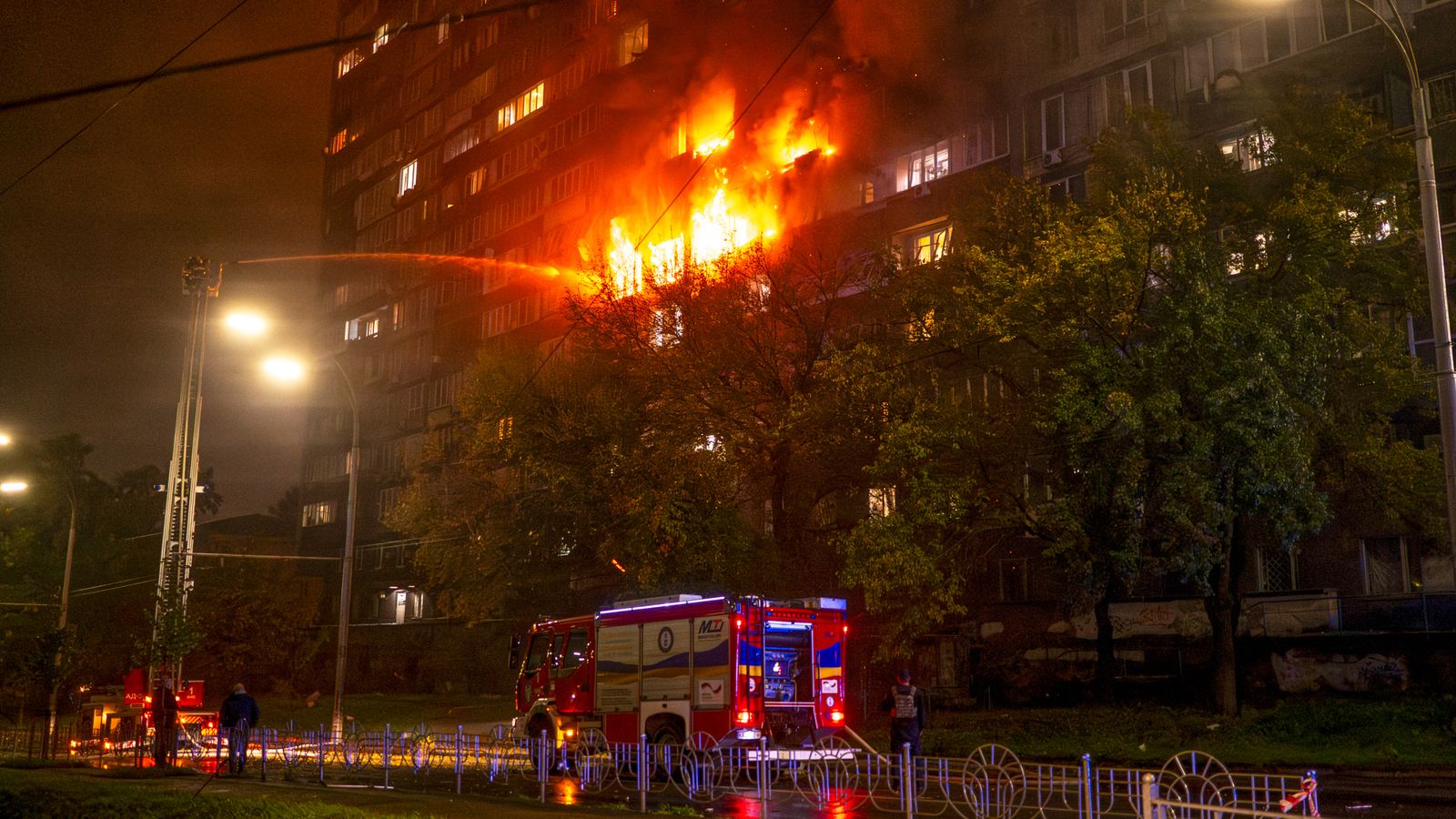 A block of flats in Kyiv caught fire after being hit. Pic: Reuters
