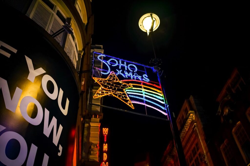 a shooting star design made out of christmas lights emblazoned with 'soho xmas'