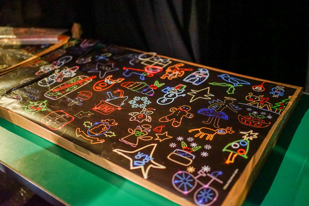 a table showing the children's designs for the christmas lights