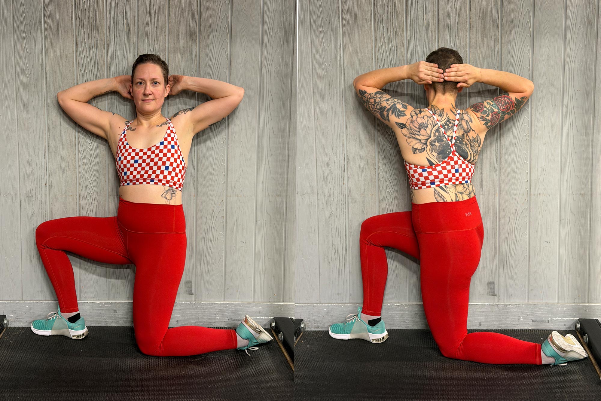A woman stretching against a wall