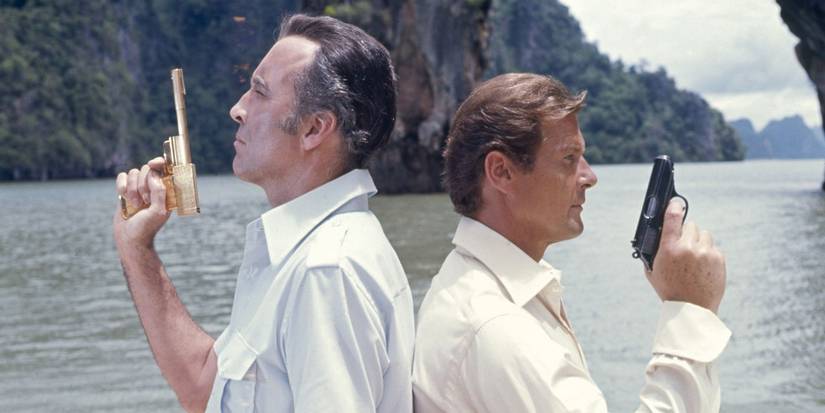 Francisco Scaramanga (Christopher Lee) and James Bond (Roger Moore) stand back to back holding guns in the movie The Man with the Golden Gun.