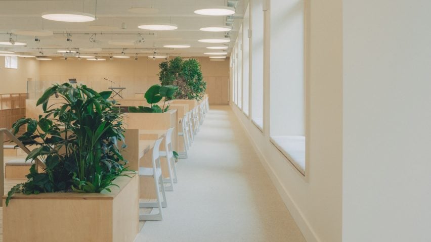 Desks and window seats inside The Pool