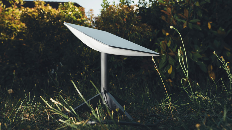 A Starlink satellite in a grassy area