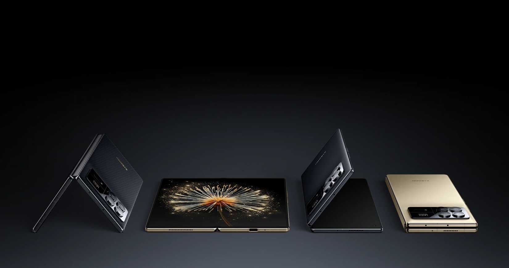 Four Xiaomi Mi Mix 3 Fold phones lying on a flat surface, shown in various stages of unfolding.