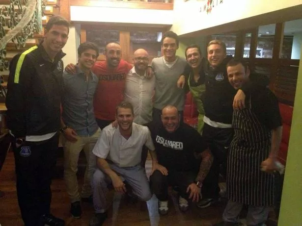 Liverpool and Everton players at Amalia restaurant in Liverpool city centre - left to right Joel Robles, Joao Teixeira, Jose Enrique, Miguel Queipo (owner) Tiago ILori, staff, Gerard Delofeu, Antonio Lixi ( Amalia head chef-co owner)
