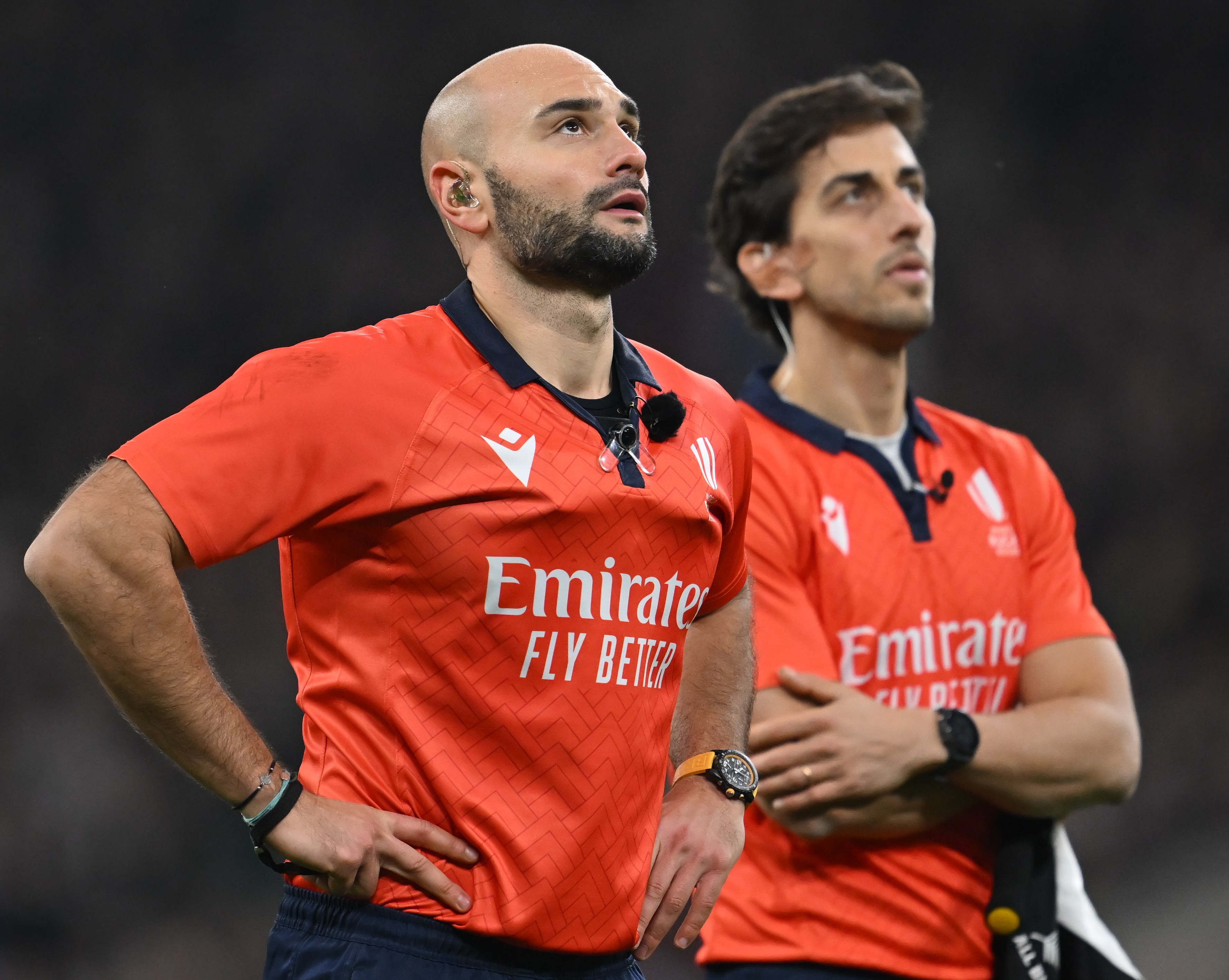 Rugby referee Andrea Piardi checking with the TMO.