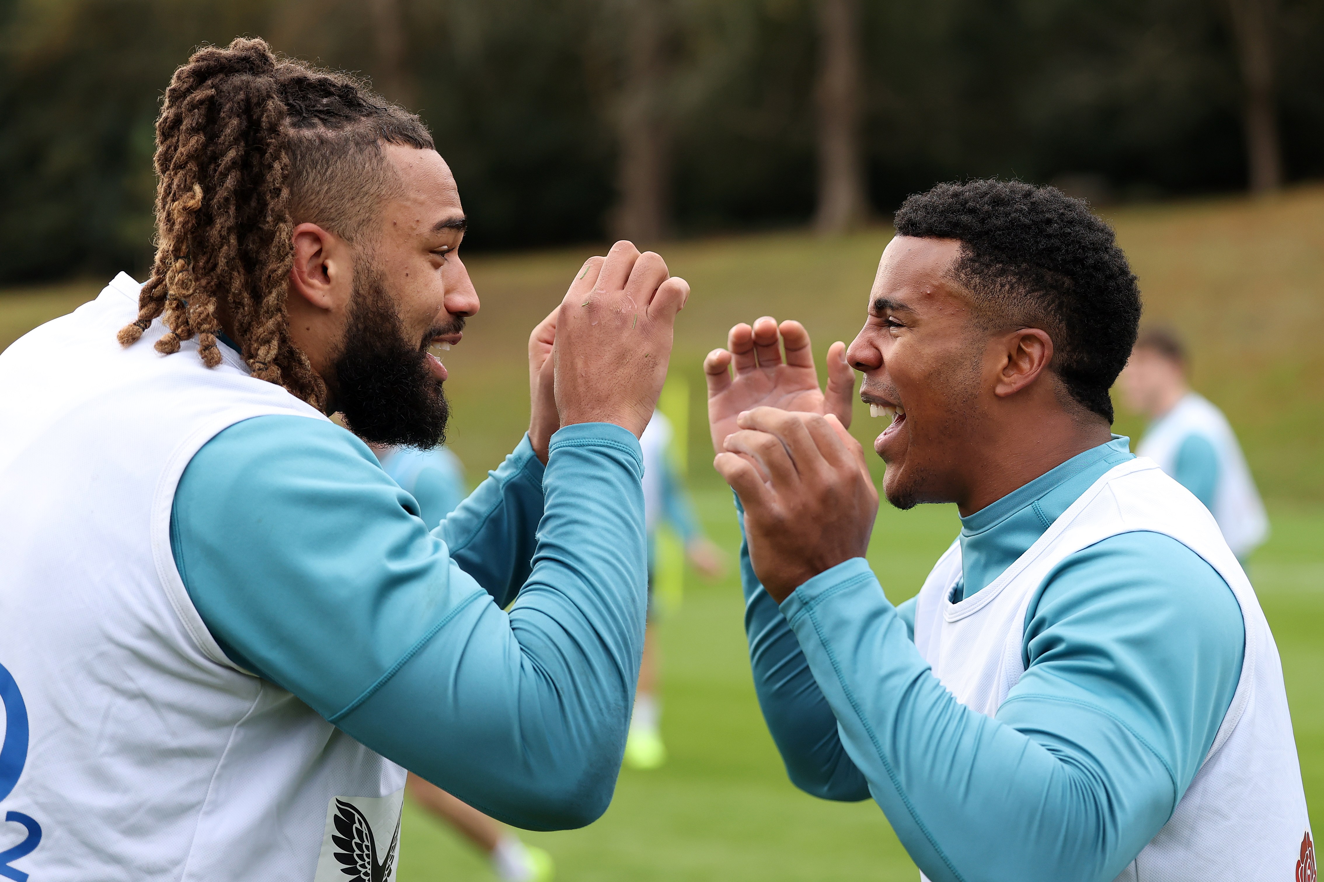 Chandler Cunningham-South and Immanuel Feyi-Waboso laughing during England training.