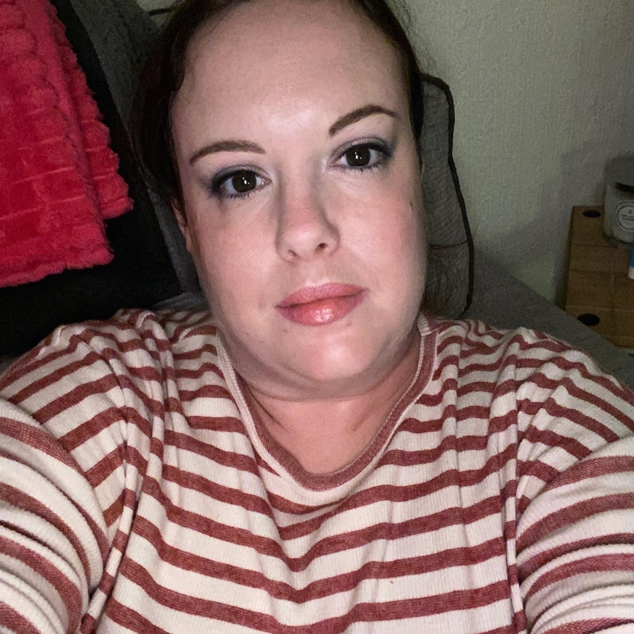 Katie Fox in a red and white striped shirt.