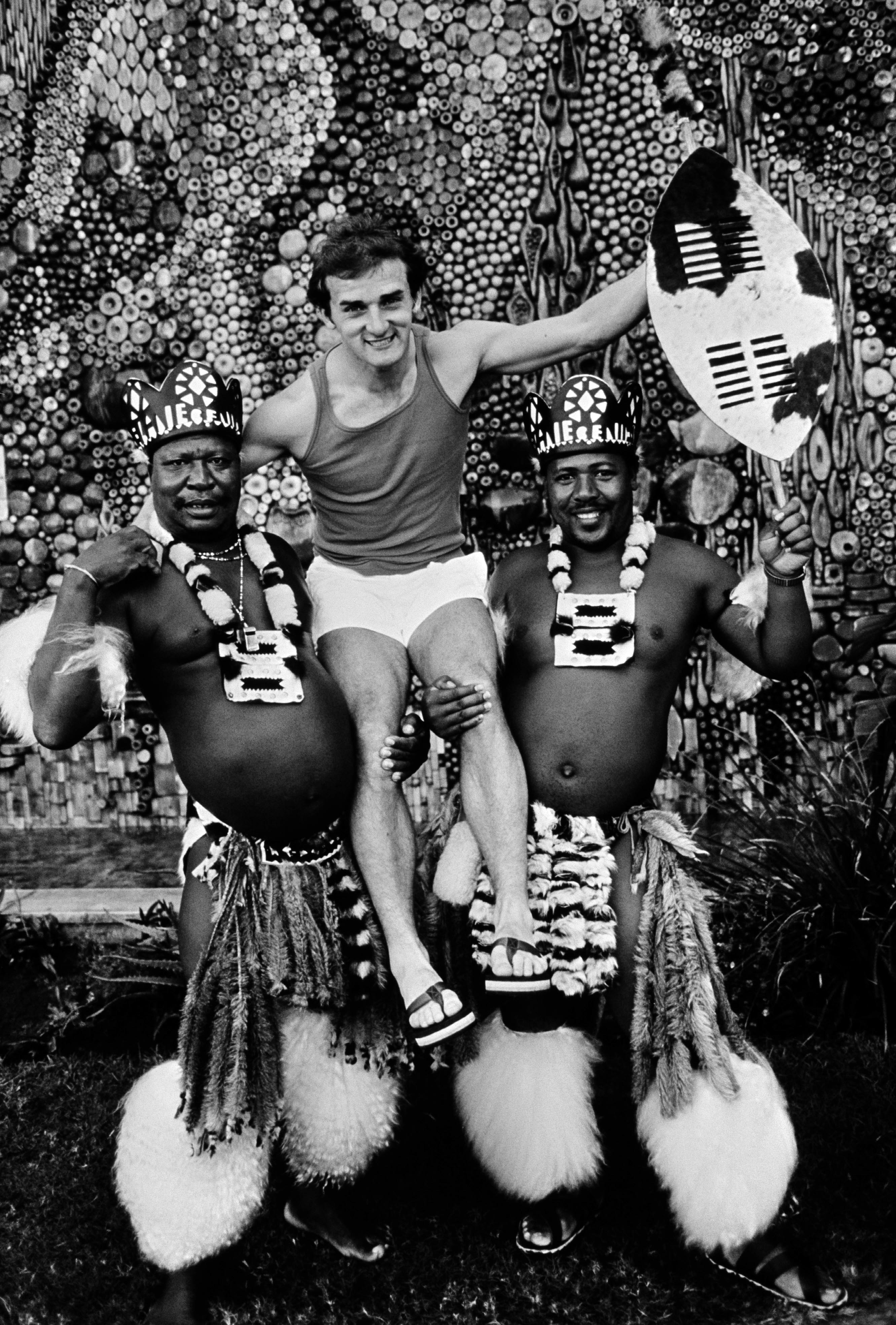 Peter Morgan of the British Lions rugby team with two Zulu warriors during a tour of South Africa.