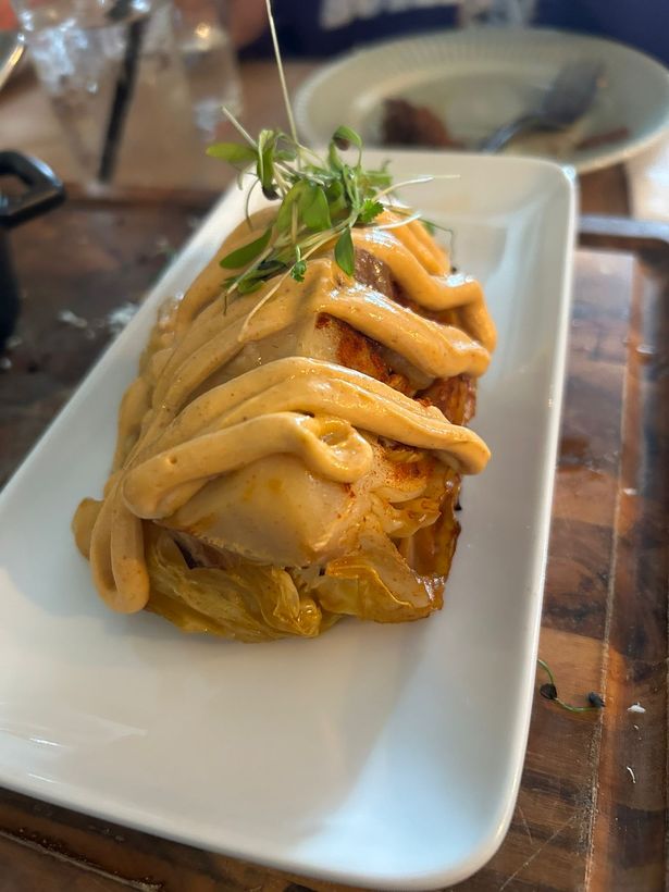 A plate of hispi cabbage with chipotle emulsion