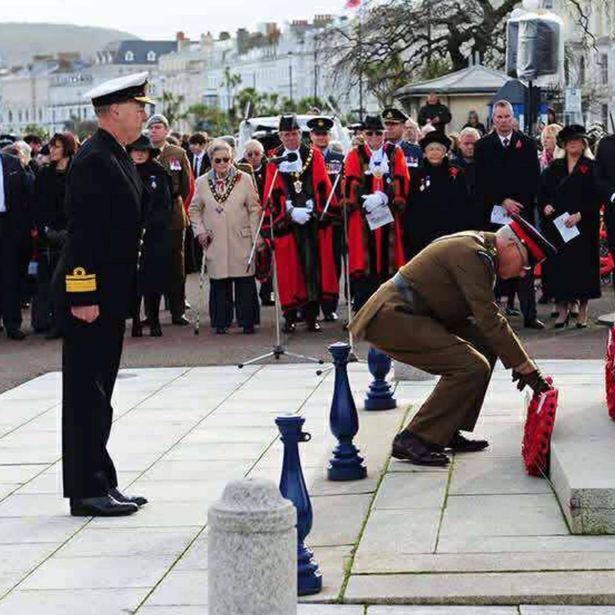 He stood to attention as a wreath was laid before saluting Llandudno's Cenotaph on Sunday